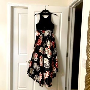 A high low dress, black, tank top. A-line floral bottom.  Size 4. Nicole Miller